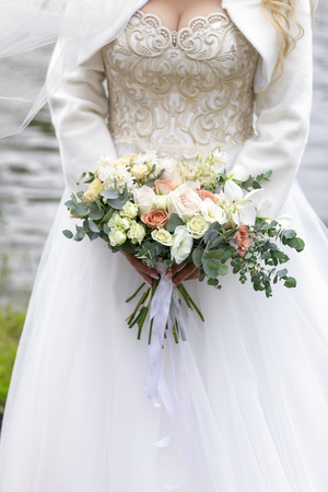 Beautiful bouquet of the bride. Summertime on the riverの写真素材