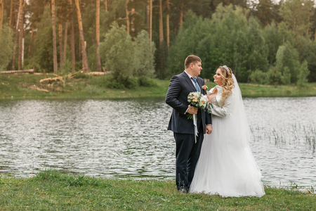 Wedding day. Newlyweds on the nature. Just marriedの写真素材