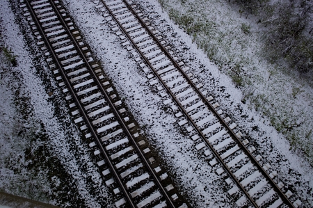 High angle view of snow covered railroad tracks, Northern Alberta, Alberta, Canadaの写真素材