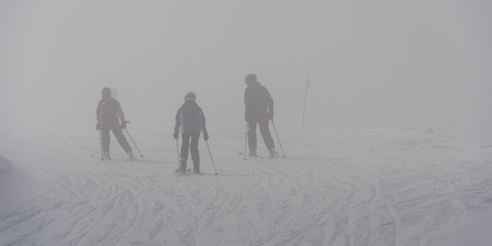 Tourists skiing, Whistler, British Columbia, Canadaの写真素材