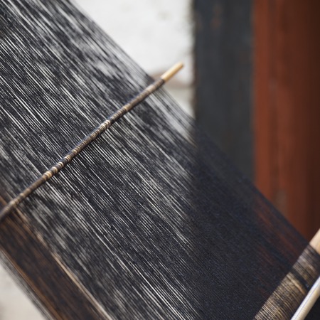 Weaving textiles on a loom in  Chhume Valley, Bhutan