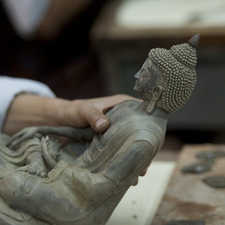 Buddha statue at Thirteen Arts and Crafts School in Bhutanの写真素材