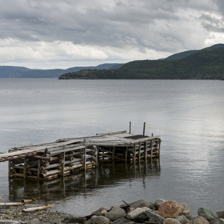 Pier on lake, Gros Morne National Park, Newfoundland and Labrador, Canadaの写真素材