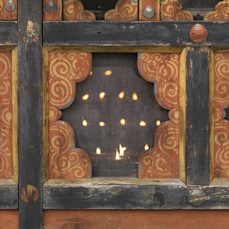 Oil lamps burning in Kyichu Lhakhang, Lamgong Gewog, Paro Valley, Paro District, Bhutanの写真素材