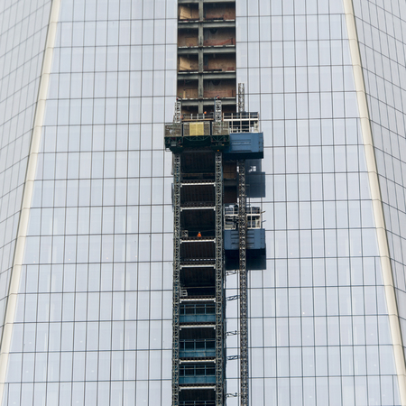 Low angle view of a modern office building, Manhattan, New York City, New York State, USAの写真素材