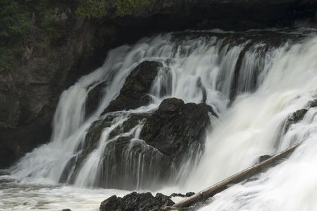 Waterfall in a forest, Plaisance Falls, Petite-Nation River, Quebec, Canadaの写真素材