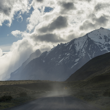 View of road with mountains, Torres del Paine National Park, Patagonia, Chileの写真素材