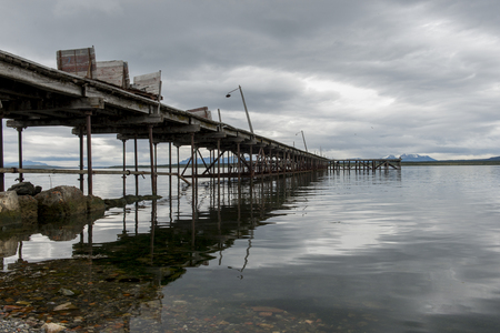 View of a pier at lake, Puerto Natales, Patagonia, Chileの写真素材