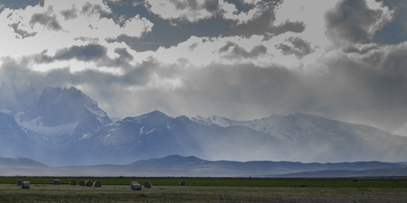 Clouds over mountain range, Torres Del Paine National Park, Patagonia, Chileの写真素材