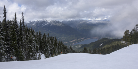 High angle view of lake with mountains in winter, Whistler, British Columbia, Canadaの写真素材