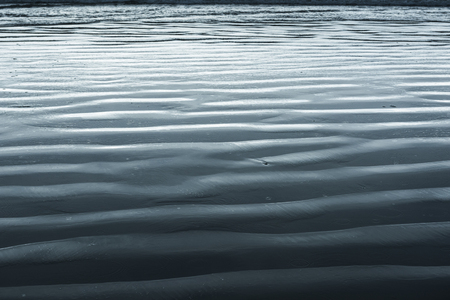 Wet sand patterns on beach, Cox Bay, Pacific Rim National Park Reserve, Vancouver Island, British Columbia, Canadaの写真素材