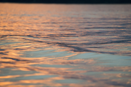 Surface of the water on the Lake at dusk, Lake of The Woods, Ontario, Canadaの写真素材