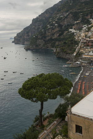 View of town at coast, Positano, Amalfi Coast, Salerno, Campania, Italyの写真素材