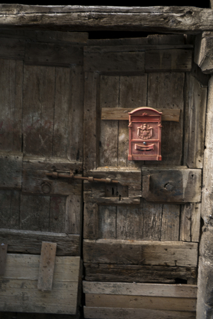 Mail box mounted on a dilapidated door, Orvieto, Terni Province, Umbria, Italyの写真素材