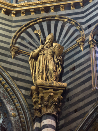 Saint statue at Siena Cathedral, Siena, Tuscany, Italyの写真素材