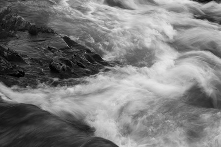 Water flowing through rocks, Lake Sherburne, Many Glacier, Glacier National Park, Glacier County, Montana, USAの写真素材