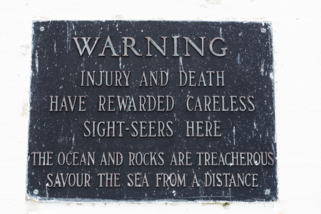 Warning sign at Peggy's Point Lighthouse, Peggy's Cove, Nova Scotia, Canadaの写真素材
