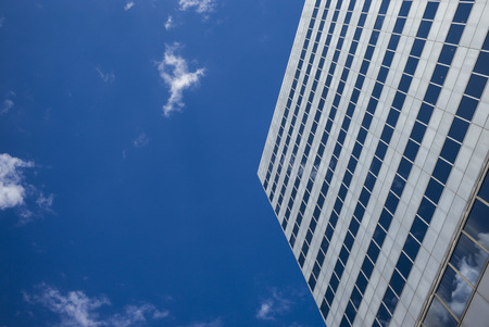 Low angle view of a modern office building against sky, Minneapolis, Hennepin County, Minnesota, USAの写真素材