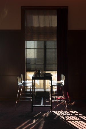 Empty chairs and table arranged in house, Minneapolis, Hennepin County, Minnesota, USA