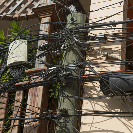 Low angle view of cables at a telephone pole, Utila Island, Bay Islands, Honduras