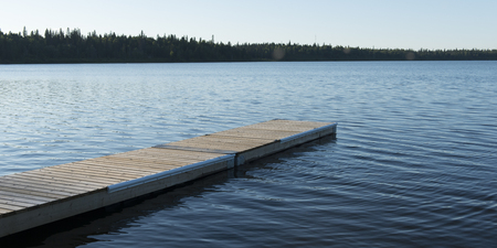 Boardwalk in a lake, Wasagaming, Riding Mountain National Park, Manitoba, Canadaの写真素材