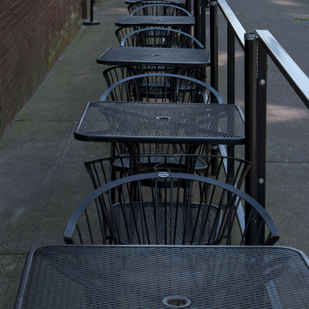 Tables and chairs at a sidewalk cafe, Pioneer Square, Seattle, Washington State, USAの写真素材