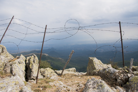 Fencing in the rugged Pyrenean mountainsの写真素材