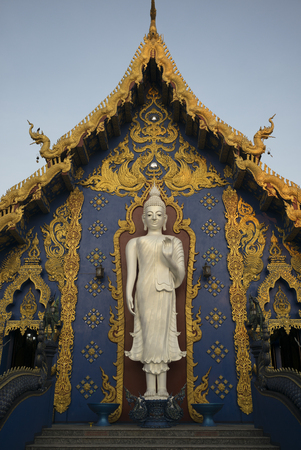 Statue of Buddha at temple, Rong Suea Ten Temple, Chiang Rai, Thailandの写真素材