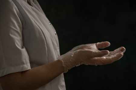 Thoughtful doctor holding chest and lungs xray in medical officeの写真素材