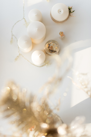 Christmas interior in natural light of sunny day. Candles and garland. Top Viewの写真素材