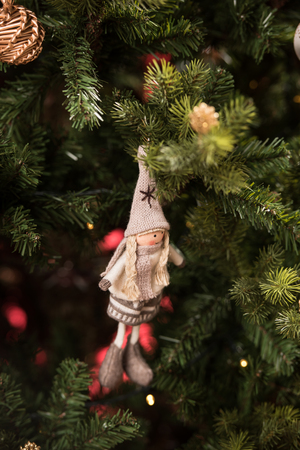 Decorated Christmas tree on red backgroundの写真素材