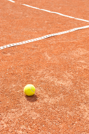 Tennis ball on clay courtの写真素材