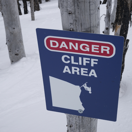 Close-up of warning sign on tree, Whistler, British Columbia, Canadaの写真素材