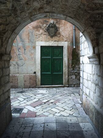 Closed door seen through arch, Kotor, Bay of Kotor, Montenegroの写真素材