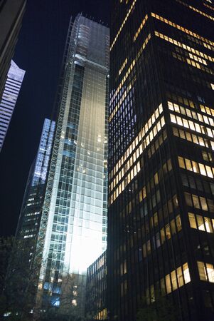 Skyscrapers lit up at night, New York City, New York State, USAの写真素材