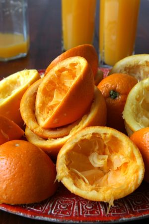 Squeezed oranges and orange juiceの写真素材