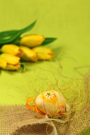 Easter egg with flower, decoration and tulipsの写真素材