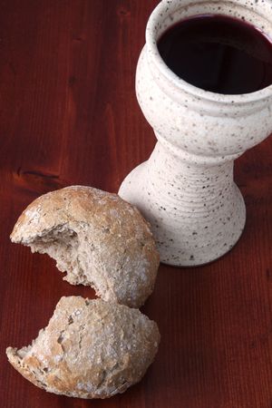 Bread and chalice with red wineの写真素材