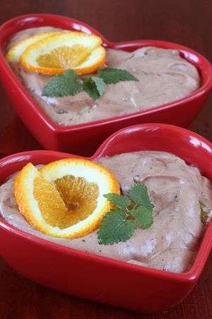 Chocolate mousse with oranges in heart shaped bowlsの写真素材