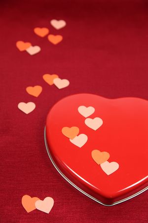 Heart shaped box with little paper heartsの写真素材