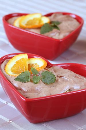 Chocolate mousse with oranges in heart shaped bowlsの写真素材