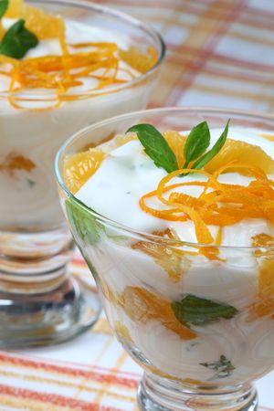 Mint yogurt dessert with orangesの写真素材