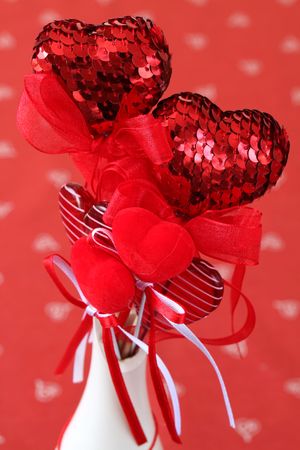 Various kinds of heart decorations in a vaseの写真素材
