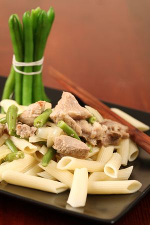 Penne rigate with pork and green beansの写真素材
