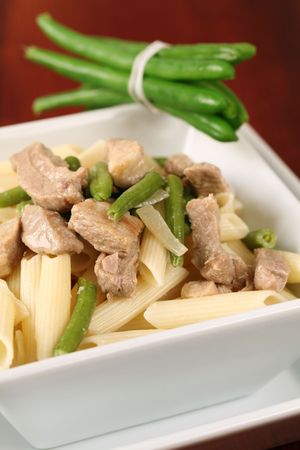 Penne rigate with pork and green beansの写真素材