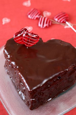 Heart shaped chocolate cake with heart pins の写真素材