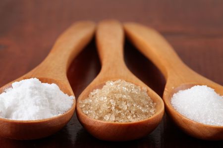 Sugar in wooden spoonsの写真素材