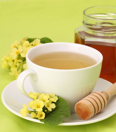 Healthy herbal tea made from freshly picked primroses with honeyの写真素材