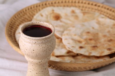 Wine and pita bread in a basketの写真素材