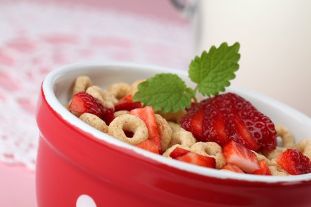 Honey cereals with strawberries and milkの写真素材